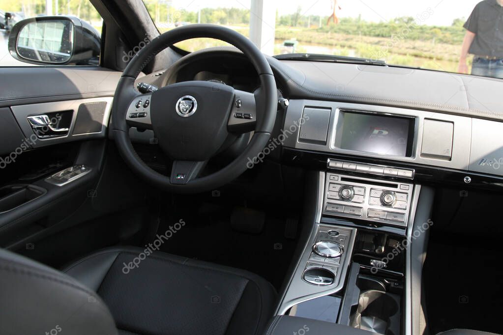 Bordeaux, France -  10 09 2024 : Jaguar car interior with steering wheel dashboard and screen on central panel