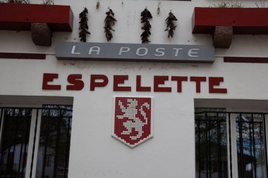 Espelette , France -  04 15 2024 : La Poste sign brand logo and Espelette french text sign of office Post store in France clipart