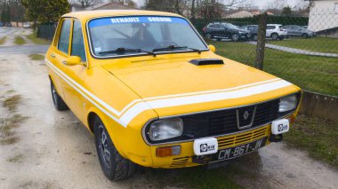 Bordeaux , France - 12 24 2024 : Renault R12 Gordini yellow sport car vintage oldtimer automobile french clipart