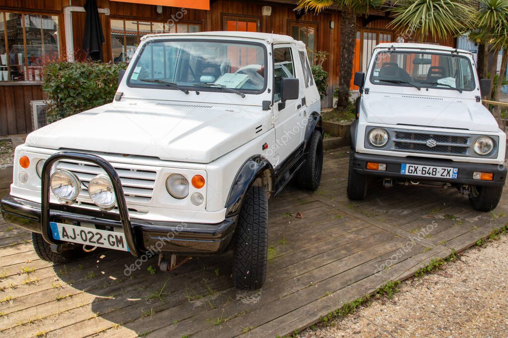 Bordeaux , France -  31 03 2025 : suzuki samurai 413 car four wheels with logo brand sign parked in street Japanese multinational corporation automobiles