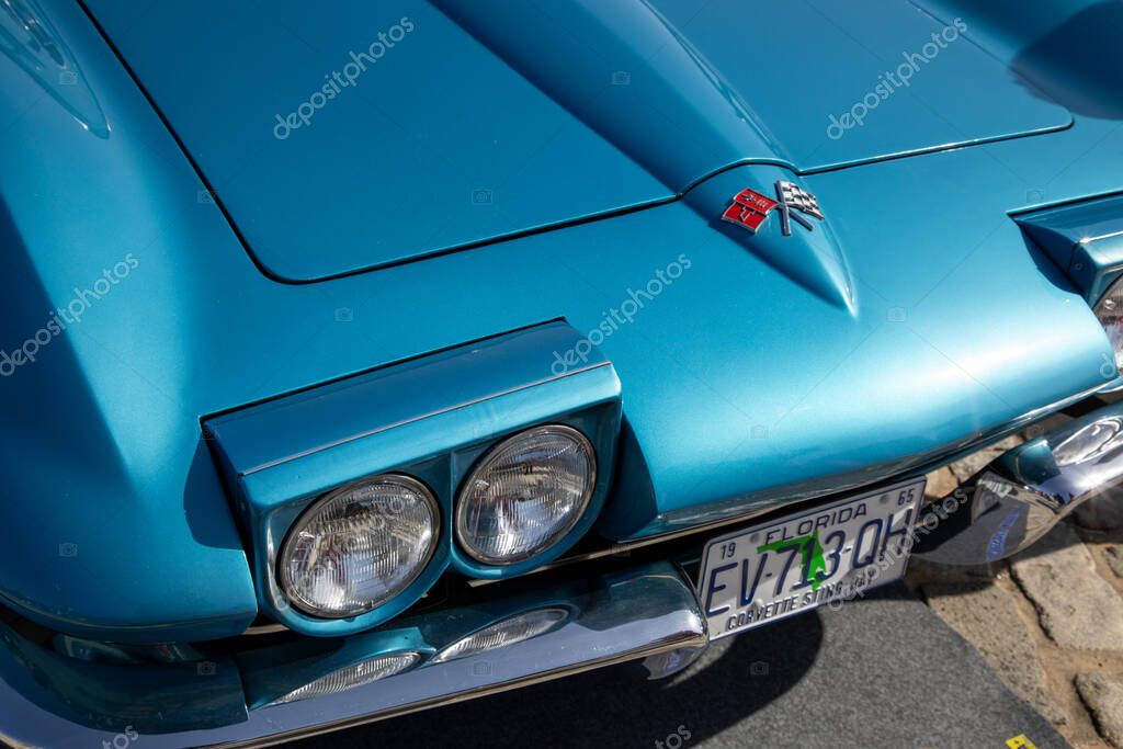 Bordeaux , France - 04 08 2025 : chevrolet corvette racing flag car sign text and logo brand race us front headlight of vintage racing american sport car