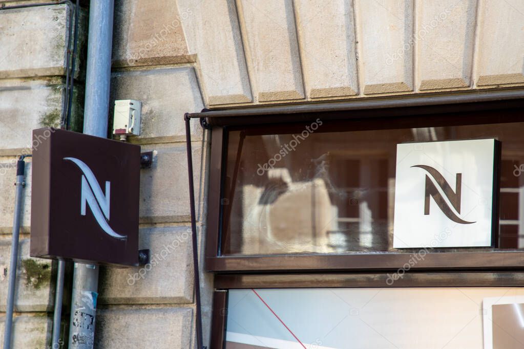 Bordeaux , France -  04 14 2025 : nespresso logo brand storefront and text sign on wall coffee shop advertising facade chain facade store