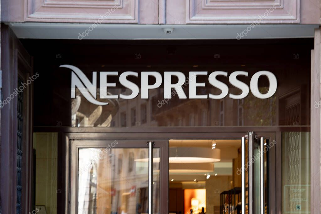 Bordeaux , France -  04 14 2025 : nespresso brand logo storefront wall and text sign of shop wall facade coffee machines capsules and accessories store