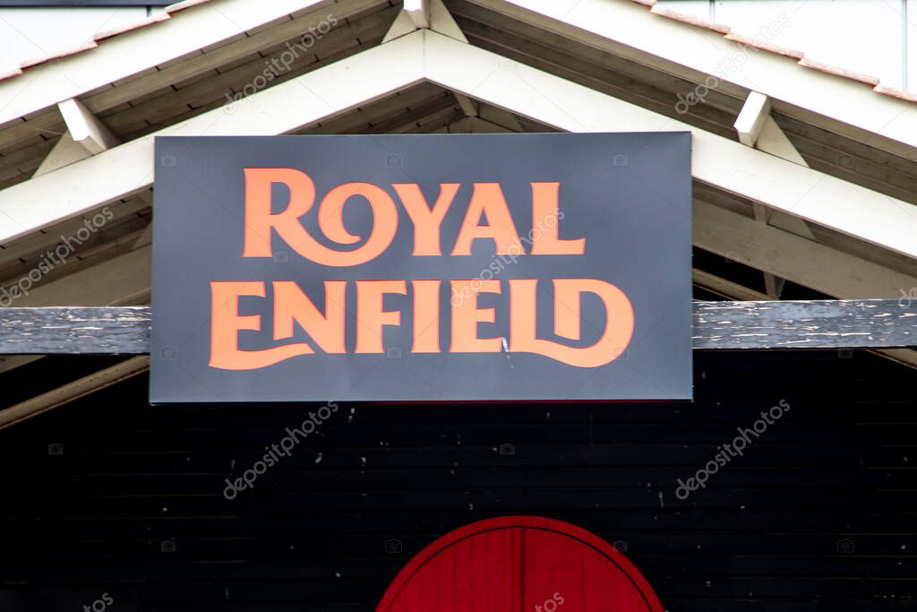 Bordeaux , France - 04 16 2025 : royal enfield indian motorcycle logo brand and text sign of india motorbike dealership wall garage facade