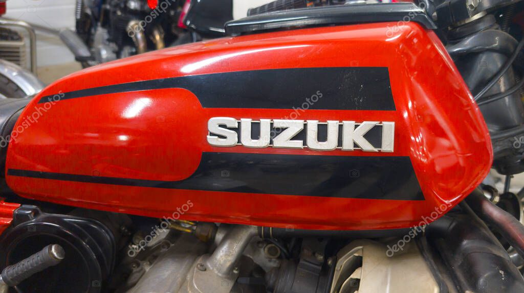 Bordeaux , France - 04 25 2025 : suzuki red tank fuel motorcycle with text logo and brand sign on side petrol motorbike vintage ancient
