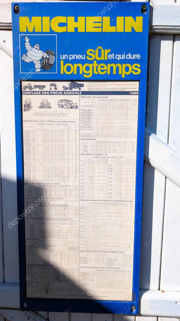 Bordeaux , France -  04 30 2025 : michelin brand logo and text sign on recommended tire pressure panel front of french tyre station garage car