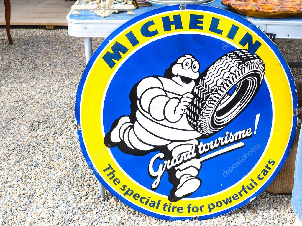 Bordeaux , France - 05 02 2025 : michelin grand tourisme panel brand logo bibendum and text sign advertising french tyre in uk american us station garage car
