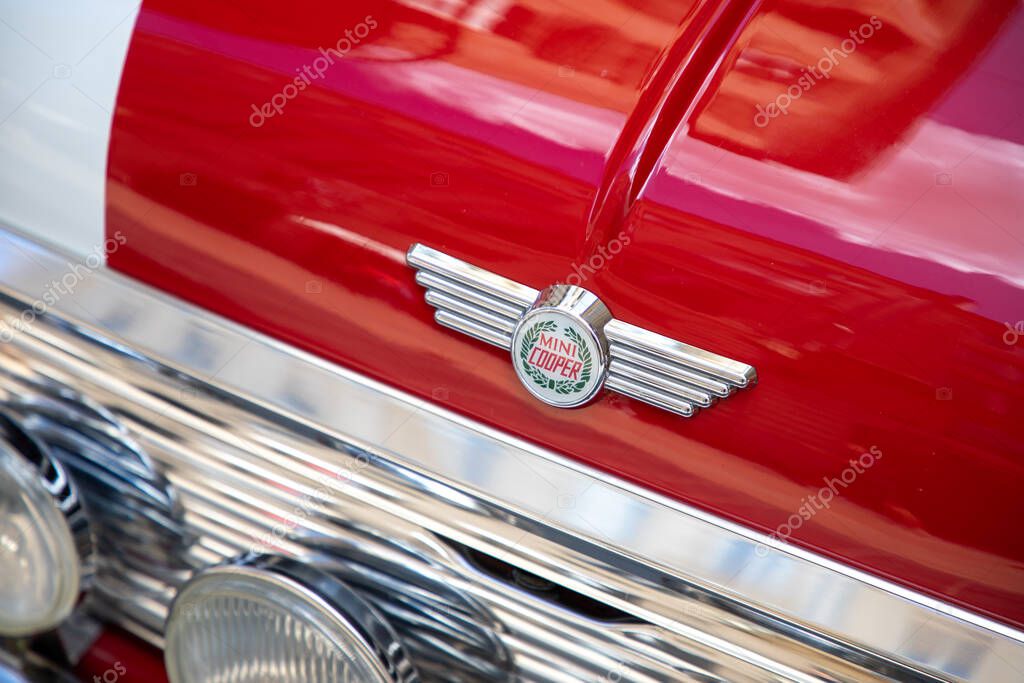 Bordeaux , France - 05 19 2025 : mini cooper car logo brand and text sign wings front of red oldtimer racing hatchback model vintage vehicle