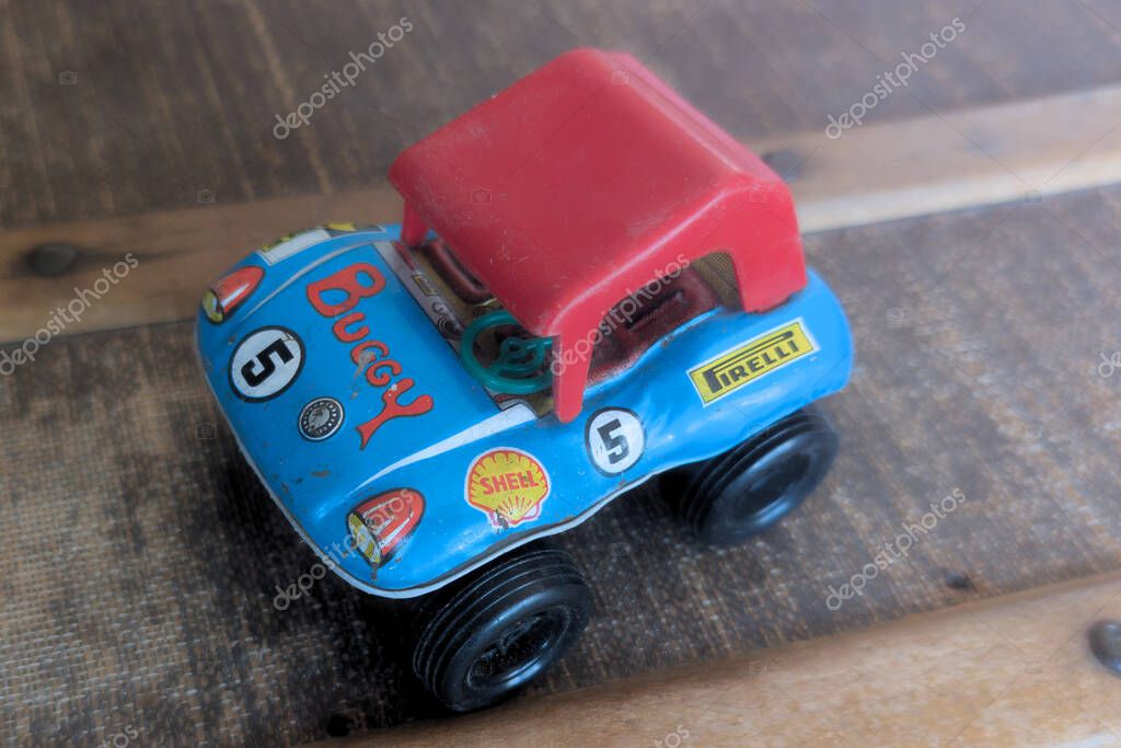 Bordeaux, france - 05 26 2025 : vw miniature beach dune buggy car tin toy with advert shell pirelli logo brand and text sign