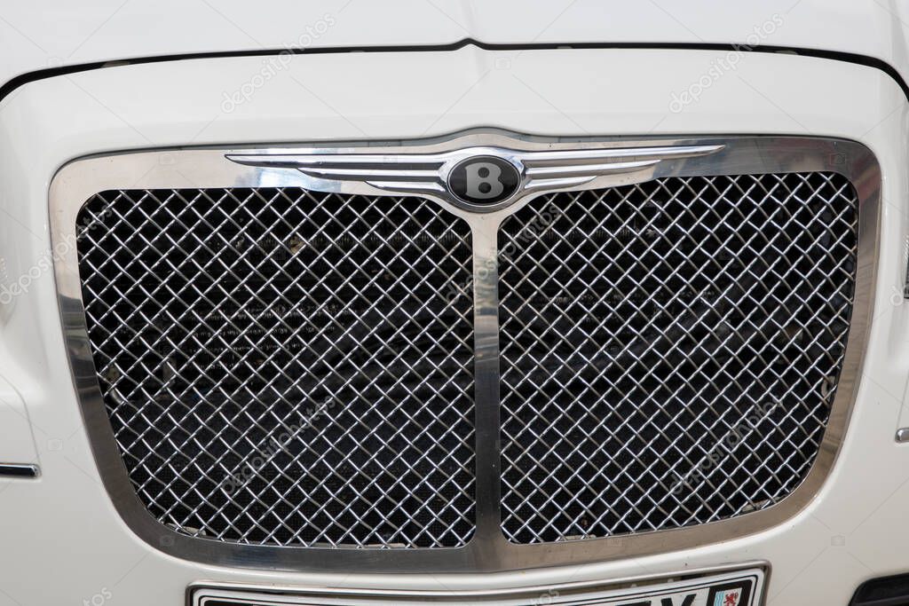 Bordeaux , France -  06 05 2025 : bentley logo brand and text sign hood emblem on chrome grille of an english car of british luxury white vehicle