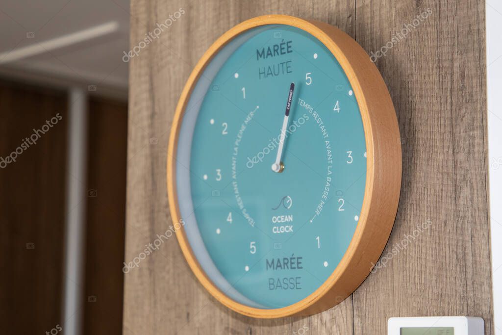 Bordeaux , France - 06 16 2025 : ocean clock logo brand and french text sign brass ships time and tide clock