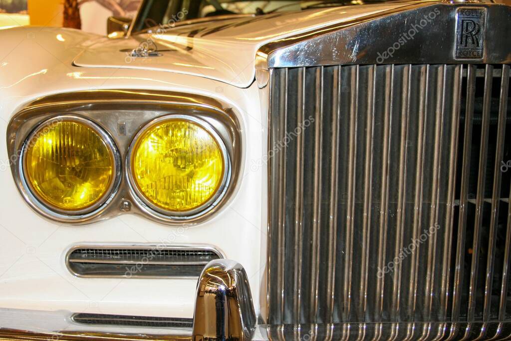 Bordeaux , France -  10 01 2025 : rolls royce silver shadow with yellow headlight gb car front logo brand and sign text on radiator grill great britain company