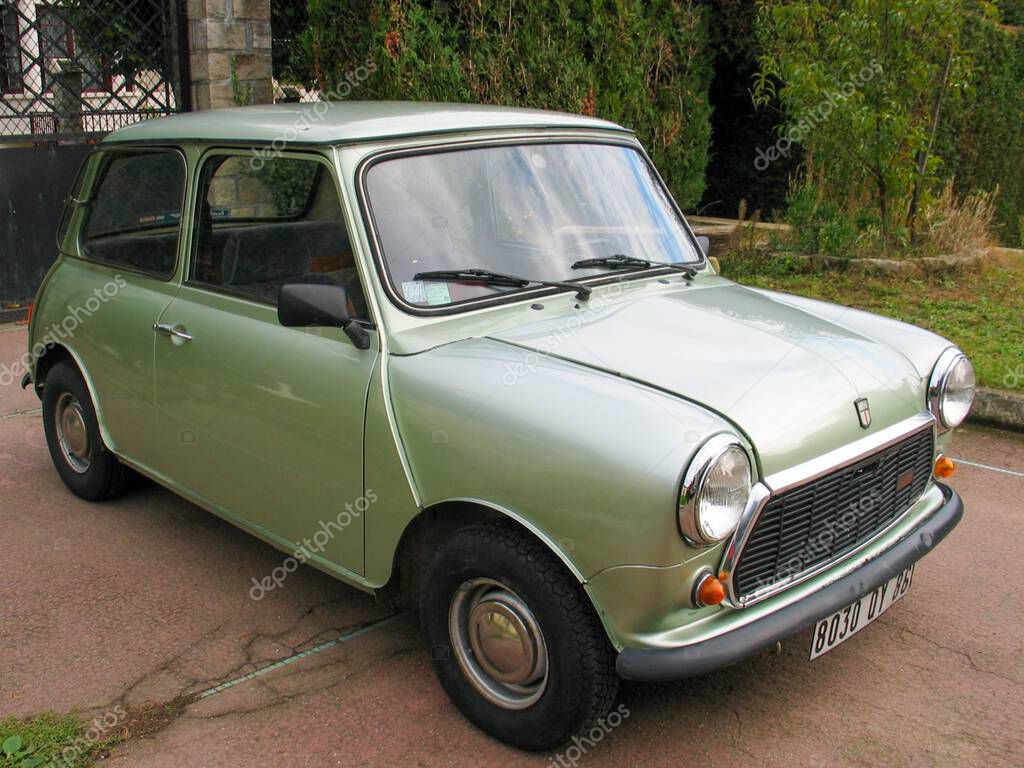 Bordeaux , France -  10 01 2025 : austin mini ancient small green car logo brand and text sign on grill sixties seventies vintage classic vehicle