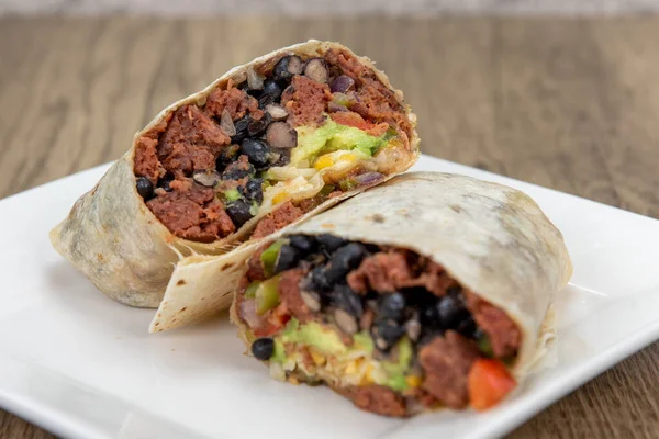 Vegetarian version of a breakfast burrito containing no meat for a healthy alternative containing protein.