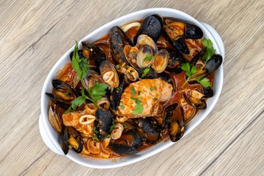 Overhead view of shell fish bowl consisting of mussles and clams, cooked to perfection. clipart