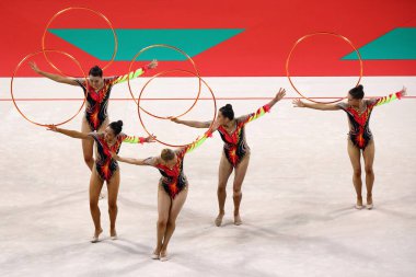 Sofia, Bulgaria - 16 September, 2022: Members of team Australia in action with 5 hoops during the 39th FIG Rhythmic Gymnastics World Championships. clipart