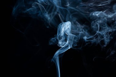 Smoke from flames or fog clouds graphic design art isolated on dark black background. clipart