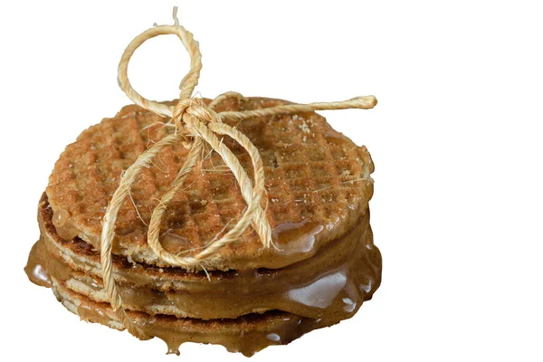 Various stroopwafel with sisal rope loop and melted glucose syrup_white background.