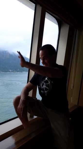 Year Old Man Cruise Ship Window Happily Saying Goodbye People_Vertical — Video