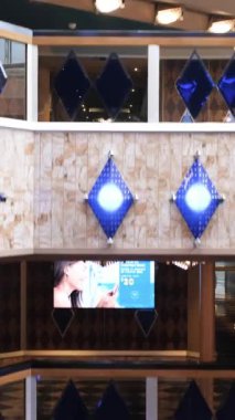 Rio de Janeiro, Rio de Janeiro, Brazil - December, 21, 2022: Panoramic elevator going down and showing the floors of a cruise ship_vertical.