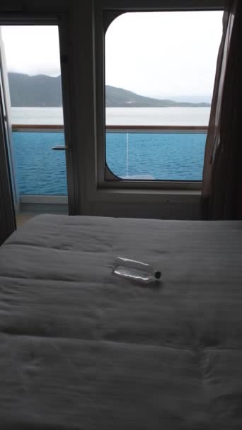 Bottle Water Bed Illuminated Light Cruise Cabin Window_Low Key_Vertical — Wideo stockowe