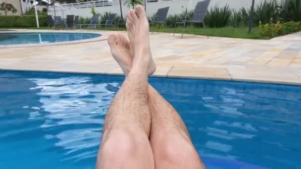 Man Sitting Spinning Pool Buoy Relaxing Sunny Day — Vídeo de stock