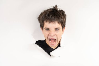 11 year old Brazilian child with only his head on a torn cardboard showing emotions_10. clipart