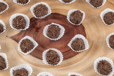 Brazilian chocolate truffle on wooden plates. Traditional Brazilian sweet_7. clipart