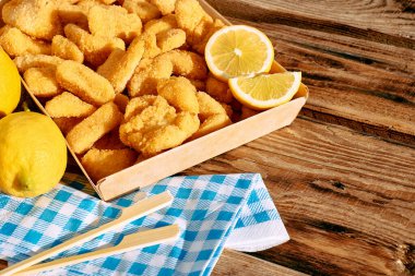 Typical Italian dish mixed deep fried seafood: shrimp, squid, octopus. Unhealthy food, fast food, street food.