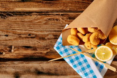 Typical Italian dish mixed deep fried seafood: shrimp, squid, octopus. Unhealthy food, fast food, street food.