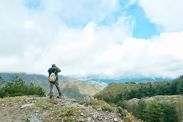 Traveler Man Hiking Mountain Forest Standing Stone Looking Binoculars Panoramic — Stock Photo, Image