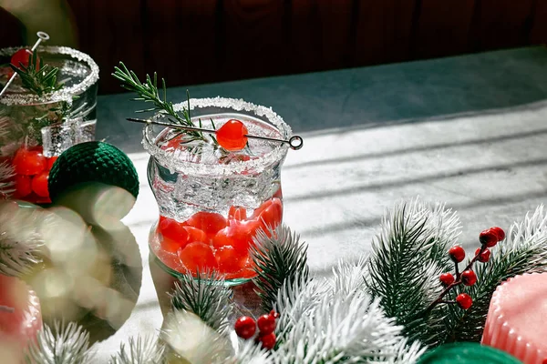Christmas cranberry cocktail. Delicious icy alcoholic drink with berries and ice. Festive mocktail for winter holidays.
