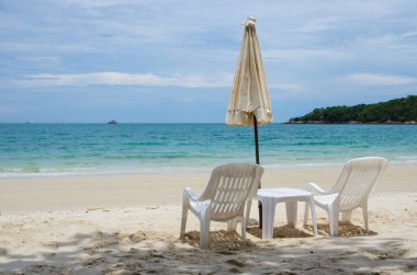 white chair with umbrella