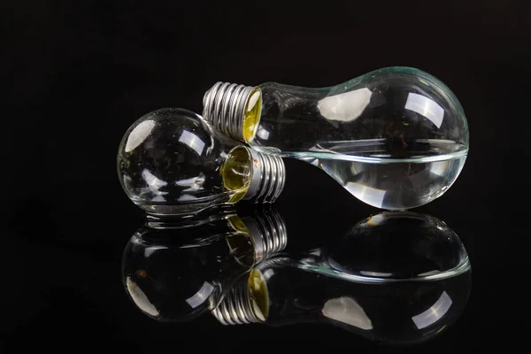 Two Turned Light Bulbs Black Background Reflection — Stock Photo, Image