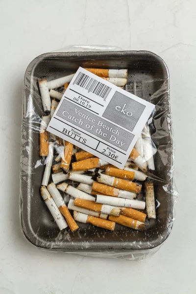 Top View Plastic Wrapped Pile Used Cigarettes Vertical Shot White — Stock Photo, Image