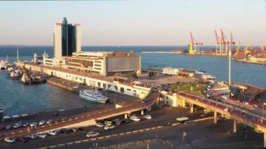 Odesa, Ukraine - 08.08.2020: View from a drone flying over Hotel Odessa and Odesa port. Cruise and cargo ship harbour.