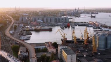 Odesa, Ukraine - 08.08.2020: Aerial drone view of Odessa sea port infrastructure. Evening sunset sky.