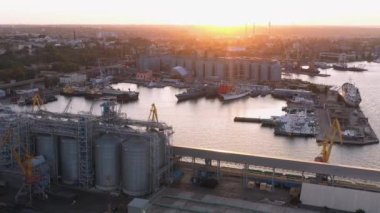 Urban scape of Odessa sea port infrastructure. Evening sunset light.