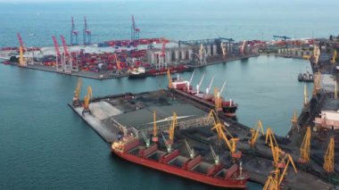 Aerial view of sea port with tower cranes and containers. Warehouse and ship.