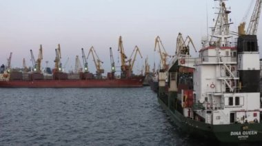 Odesa, Ukraine - 08.08.2020: Ships and tower cranes in a sea port. Harbour in Odessa, Ukraine.