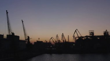 Landscape of Odessa sea port at night. Backout in Ukraine. Evening twilight sky.