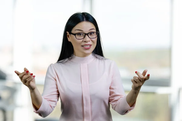 Portrait Expressive Asian Woman Gesturing Both Hands Blurred Windows Background — Stock Photo, Image