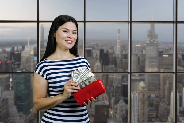 Young Asian Woman Taking Money Red Wallet Checkered Windows Cityscape — Zdjęcie stockowe