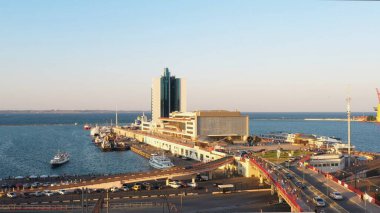 Hotel Odessa and the cruise ship terminal at Odesa port. View from the Potemkin Stairs. Evening city and sea scape.