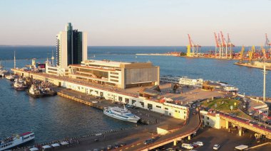 View from a drone flying over Hotel Odessa and Odesa port. Cruise and cargo ship harbour.