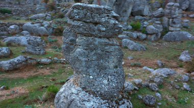 Beautiful wild landscape with rock formations. Unique granite stones at park on a summer day. Nature background.