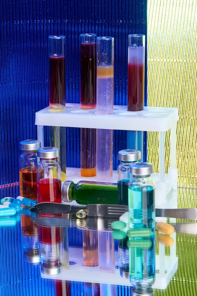 Lab test tubes and bottles with colored substance. Concept of laboratory medicine research.