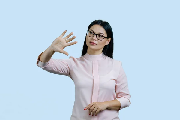 Young Asian Businesswoman Swiping Objects Invsible Touch Screen Isolated Pale — Stock Photo, Image