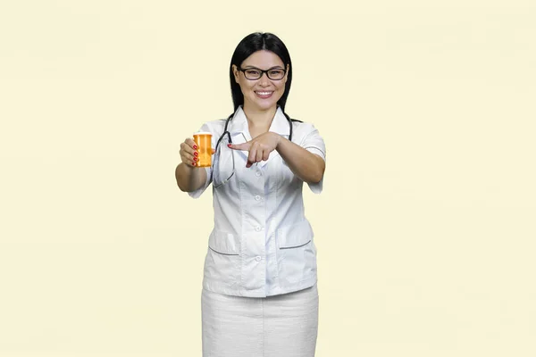 Young Female Asian Doctor Stethoscope Pointing Medicine Can Advertising Can — Stock Photo, Image
