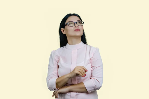 Portrait Young Pensive Asian Businesswoman Looking Isolated Pastel Yellow — Stock Photo, Image